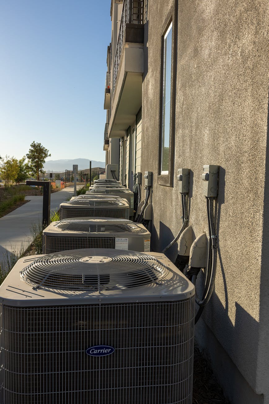 air conditioners attached to the back of a building